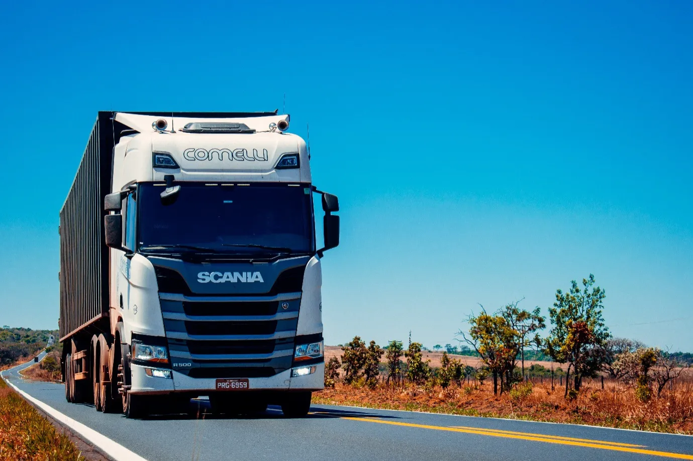 A truck driver driving a 10-wheeler on the road