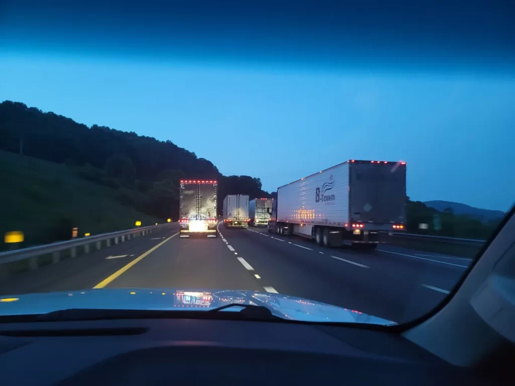 Cargo trucks on the road during night