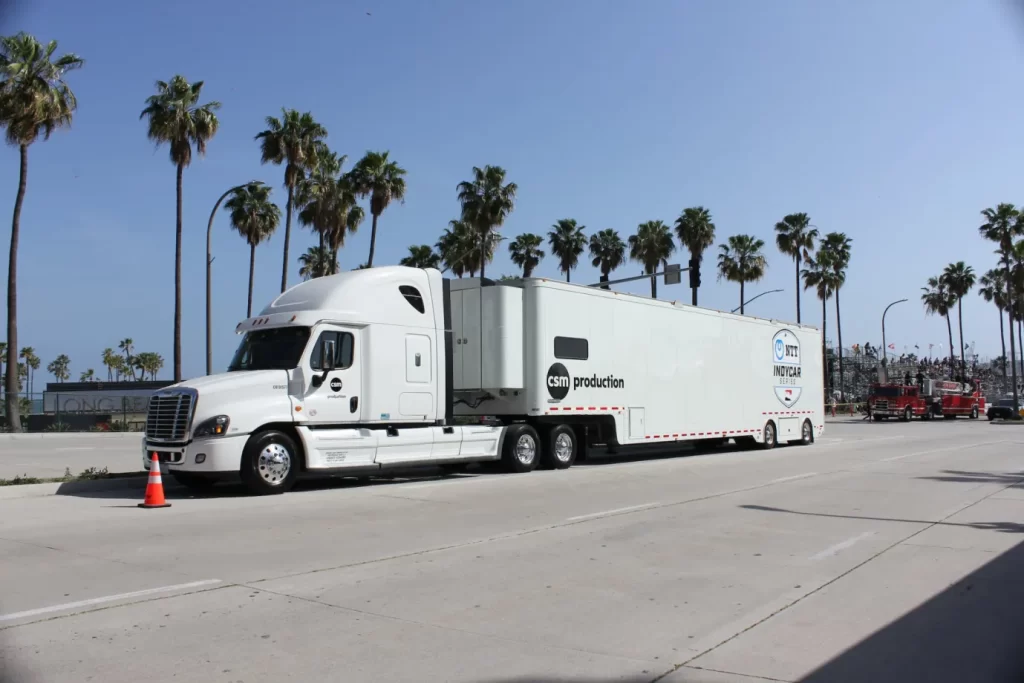 A long white cargo truck on the road
