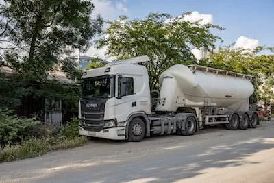 A white tanker parked on the roadside