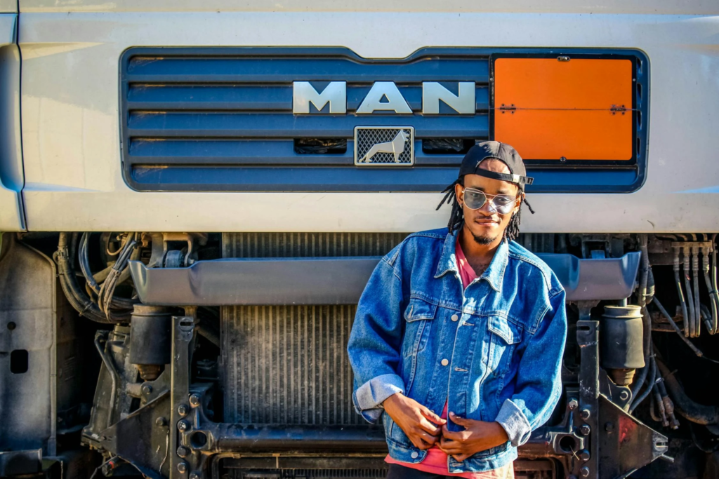 A man standing in front of a truck