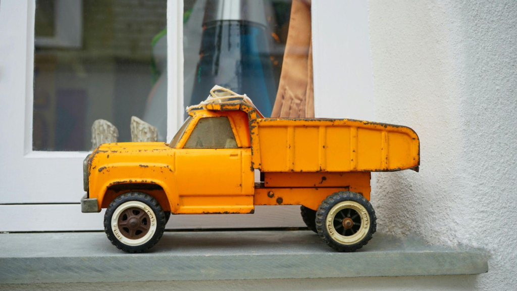A toy truck placed near a window