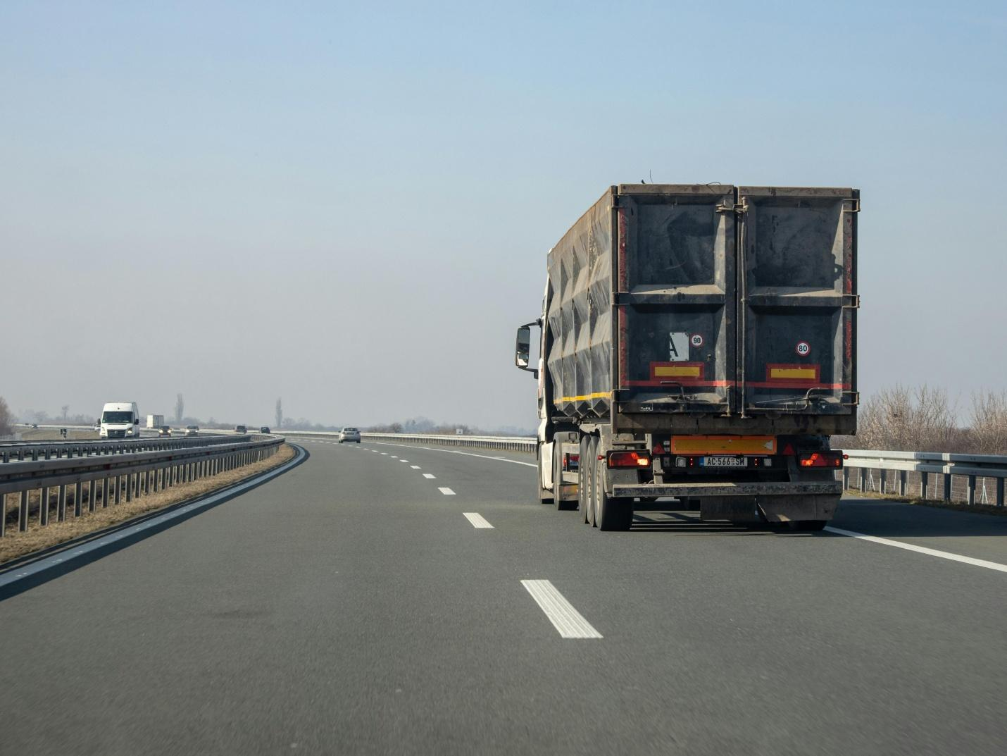 A picture of  a truck on the road