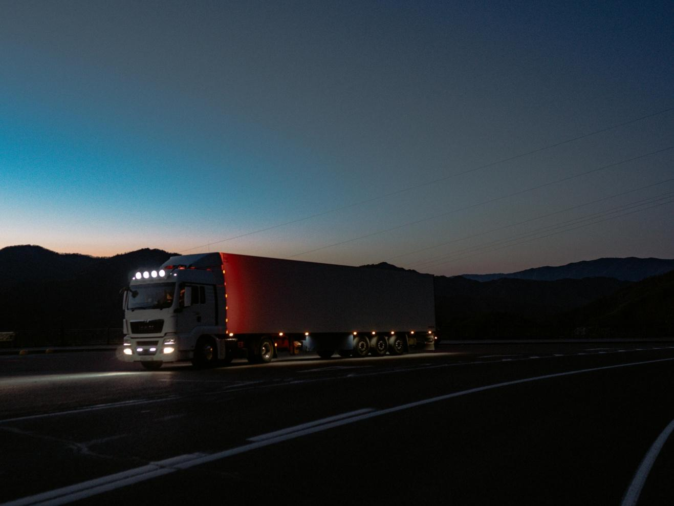 A picture of a truck on the road