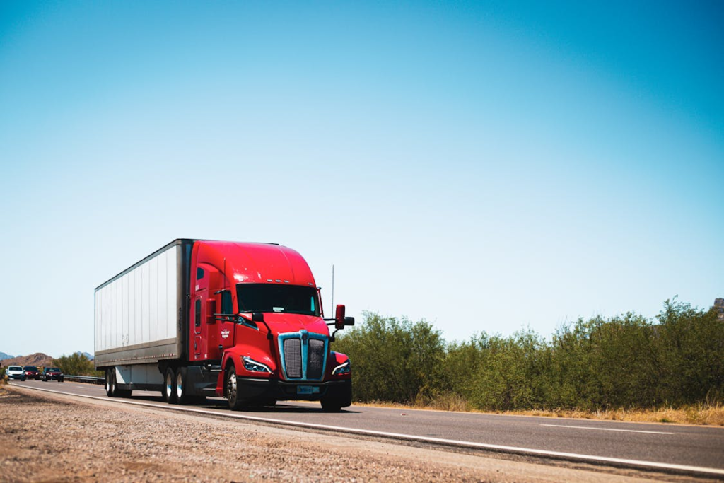 A red commercial truck on the road