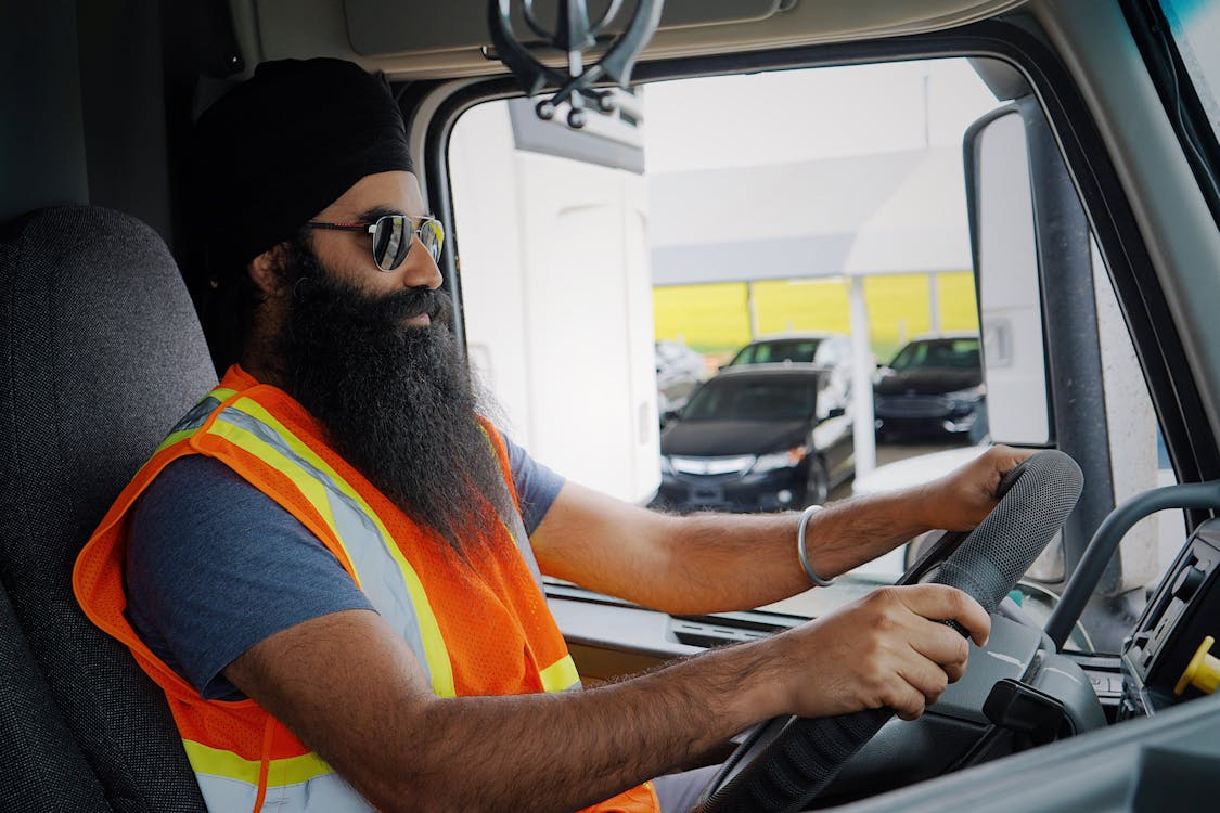 A young CDL truck driver taking the truck out on the road