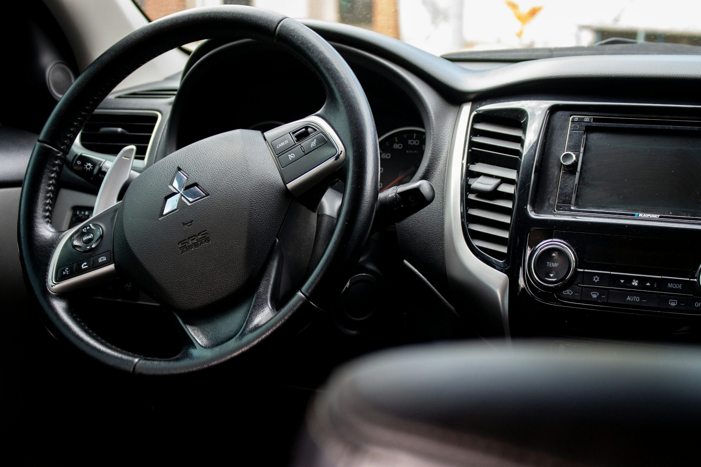 A man behind a steering wheel