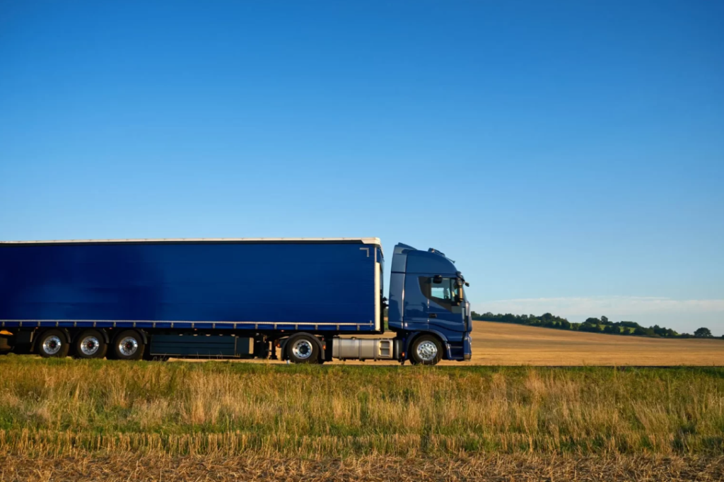 A large truck driving across the road.