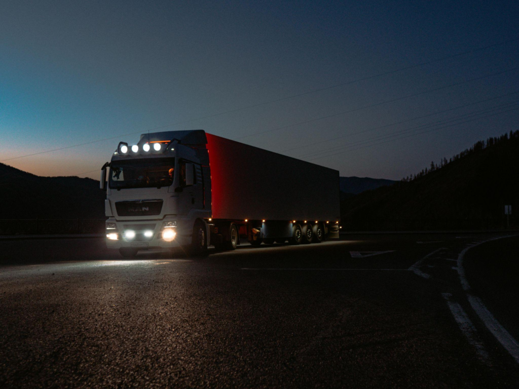 A truck driving by at night