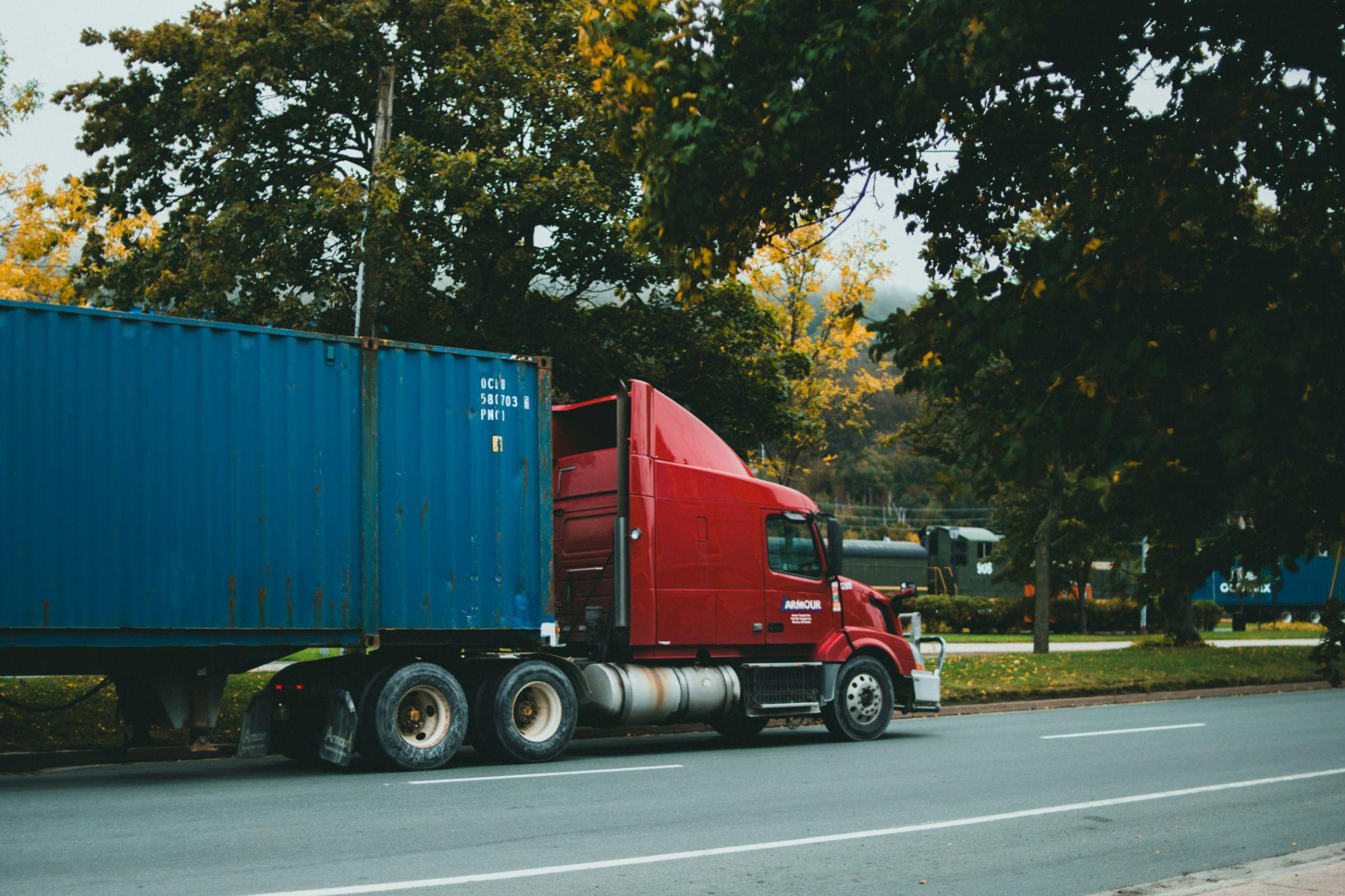A truck driving down a road
