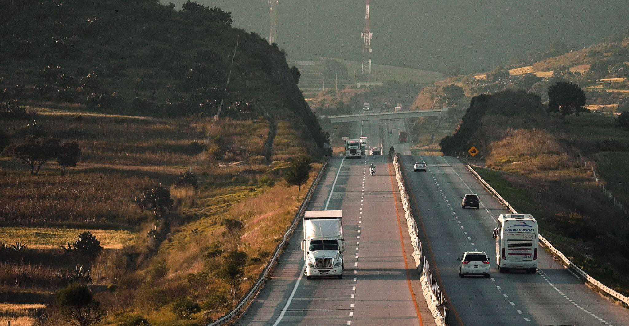 A truck driving down a highway