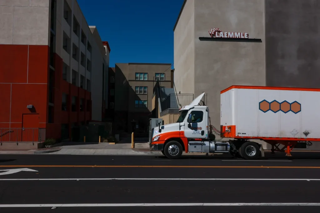 Truck in front of a building on a street