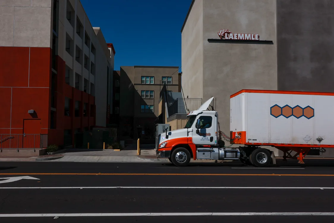 Truck in front of a building on a street