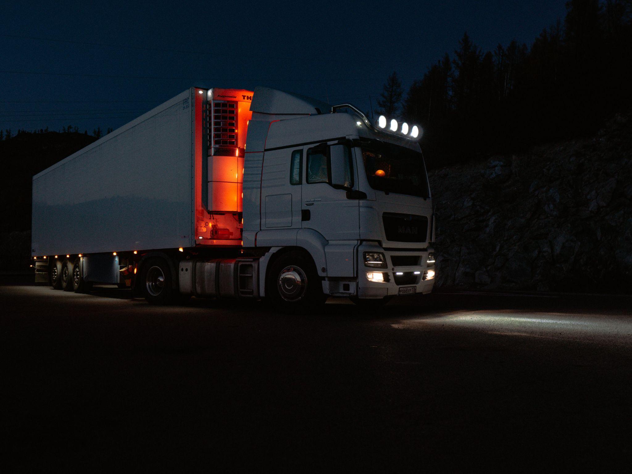 a truck driving by at night